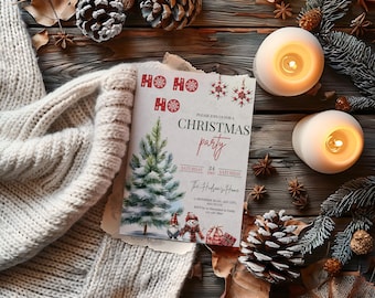 May include: A Christmas party invitation with a watercolor illustration of a Christmas tree, snowmen, and gifts. The invitation is on a wooden surface with lit candles, pine cones, and a cozy white sweater.