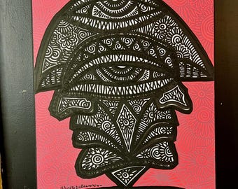 May include: Black and white abstract art painting on a pink background. The painting features a stylized face with multiple eyes and intricate patterns. The artist's signature "Wildfire Moses 2021" is visible in the bottom left corner.