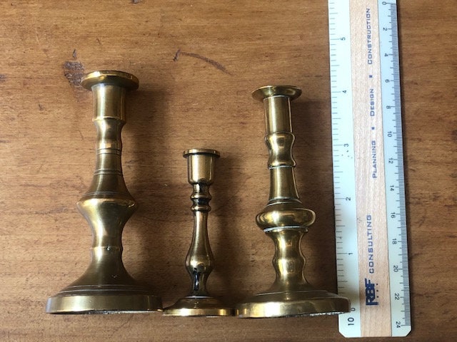 ✓SOLD✓Set of 3, small, vintage, solid brass, chamber style candle holders.  These tiny candle sticks have scalloped edges, a small round…
