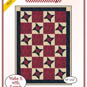 May include: A quilting pattern for a Friendship Star quilt. The pattern features a red, white, and blue color scheme and a geometric design. The pattern is for a quilt that is 44 inches by 62 inches. The pattern is made by Fabric Cafe.