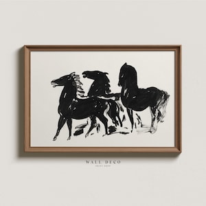 May include: Black and white line art print of three horses running. The print is framed in a brown wood frame.