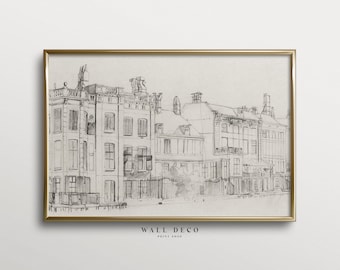 May include: A framed pencil sketch of a European cityscape. The artwork depicts a row of buildings with detailed architectural elements, including windows, chimneys, and balconies. The frame is gold-colored, and the artwork is labeled "WALL DECO PRINT SHOP".