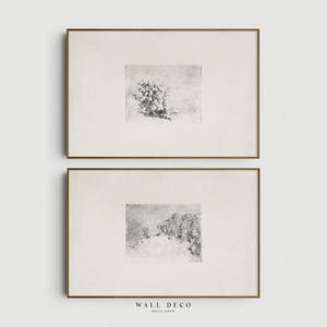 Puede incluir: Dos impresiones artísticas enmarcadas. Cada impresión presenta un boceto en blanco y negro. La impresión superior representa un arreglo floral, y la impresión inferior muestra un paisaje. Los marcos son de color marrón cálido. El texto "WALL DECO PRINT SHOP" está en la parte inferior.