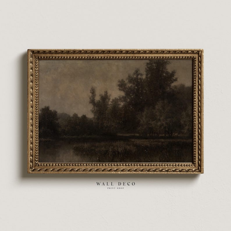 May include: A sepia-toned landscape painting in a gold frame. The artwork shows trees and water under a cloudy sky. The frame has an ornate design. The text "WALL DECO PRINT SHOP" is at the bottom of the image.