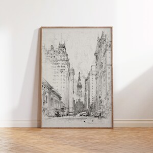 May include: A black and white sketch of a city street with tall buildings on either side. The buildings are drawn in a detailed style, with visible windows and architectural features. In the distance, a tall building with a spire can be seen.