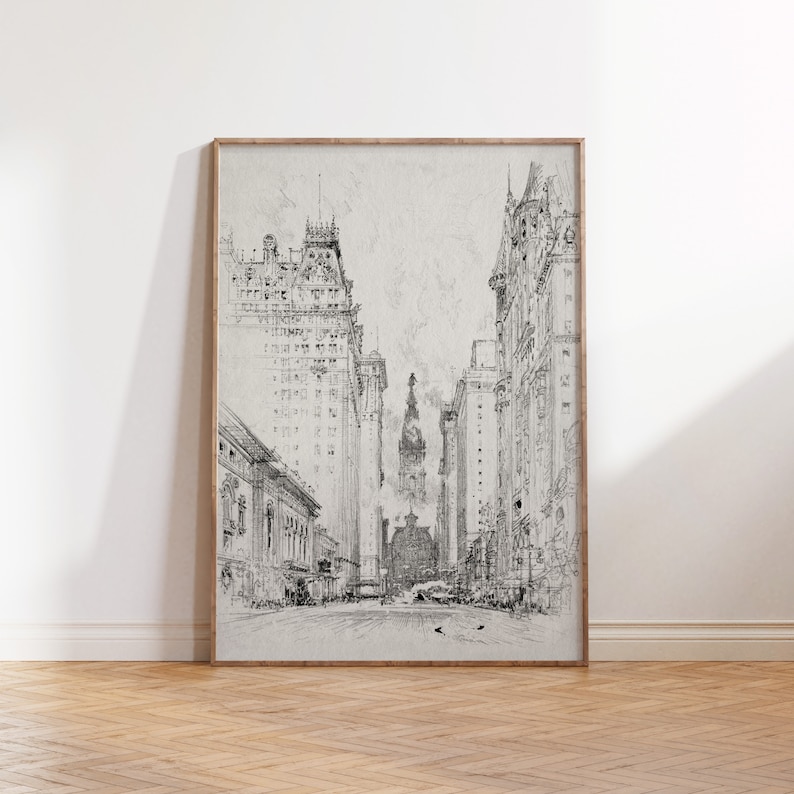 May include: A black and white sketch of a city street with tall buildings on either side. The buildings are drawn in a detailed style, with visible windows and architectural features. In the distance, a tall building with a spire can be seen.