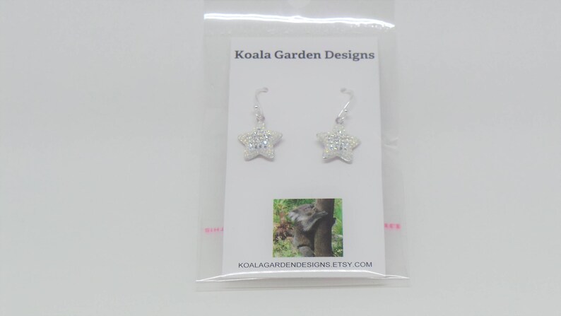 Sterling silver hook earrings featuring Swarovski star pandant. image 8