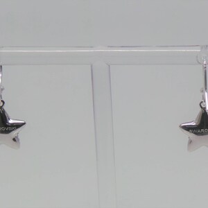 Sterling silver hook earrings featuring Swarovski star pandant. image 7