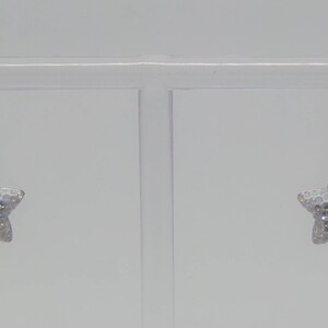 Sterling silver hook earrings featuring Swarovski star pandant. image 5