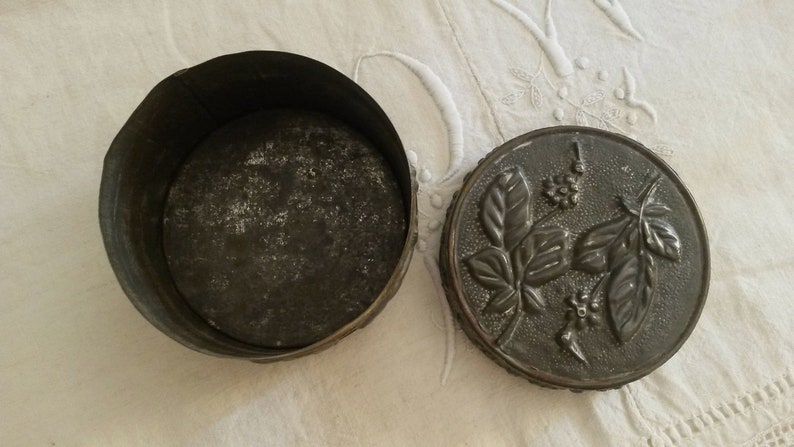 Old Tin decoration of flowers and leaves in relief vintage Silver box