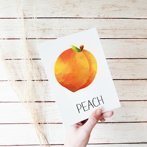 May include: A watercolor illustration of a peach with the word "PEACH" printed below it.