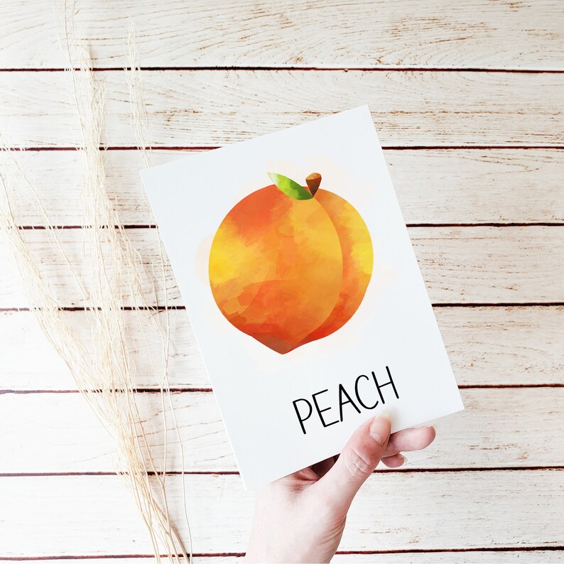 May include: A watercolor illustration of a peach with the word "PEACH" printed below it.