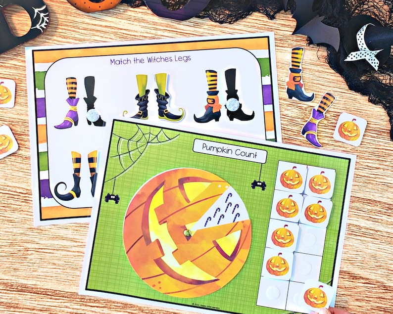 May include: A printable Halloween activity set with two games. The first game is a matching game with witch legs and boots. The second game is a pumpkin counting game with a pumpkin and candy canes.