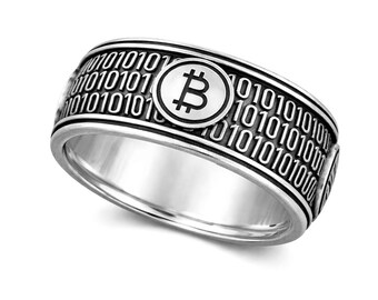 Anillo de plata de ley ennegrecida con código binario de blockchain de criptomonedas y Bitcoin