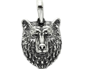 May include: Silver bear head pendant charm. The bear has a detailed, realistic design with fur and a serious expression.