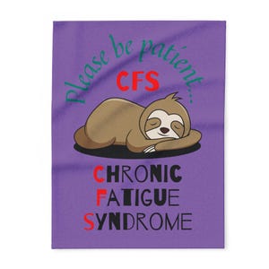 May include: A purple blanket featuring a cartoon sloth sleeping peacefully. The blanket has the text "Please be patient... CFS" in green and red, and "CHRONIC FATIGUE SYNDROME" in black and red.