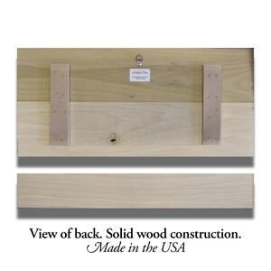 May include: Back view of a wooden sign with a hanging hook. The sign is made of two pieces of wood, and the back is reinforced with a piece of cardboard. The sign is made in the USA.