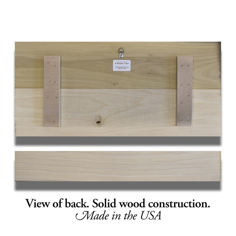 May include: Back view of a wooden sign with a hanging hook. The sign is made of two pieces of wood, and the back is reinforced with a piece of cardboard. The sign is made in the USA.