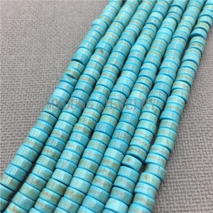 May include: A strand of turquoise blue beads with white veining. The beads are round and have a smooth, polished finish. They are strung on a clear thread.
