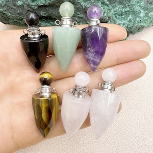 May include: Six crystal point bottle stoppers with silver caps. The stoppers are in the colors green, purple, black, yellow, white, and clear.