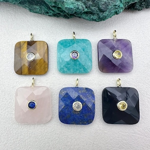 May include: Six square gemstone pendants with gold-coloured bails. The gemstones are tiger's eye, turquoise, amethyst, rose quartz, lapis lazuli, and black onyx. Each pendant has a small, round, central accent stone.