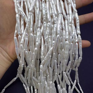 Cuentas de perlas naturales de agua dulce en forma de varilla, hebra larga de perlas barrocas Biwa de alto brillo para pendientes de diseño minimalista.