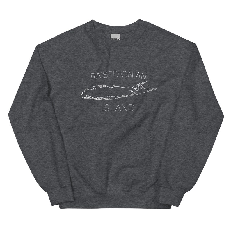 May include: A dark gray sweatshirt with the text "RAISED ON AN ISLAND" and a white outline of Long Island.