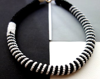 Rope necklace with black and white rocailles glass beads