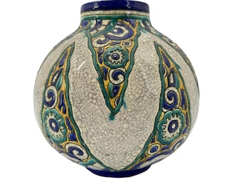 May include: A white ceramic vase with a round body and a blue, green, and yellow geometric design. The vase has a crackled glaze.