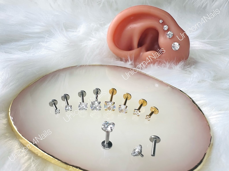 Stud screw-on earrings with bar lengths of 4mm, 6mm, 8mm, 10mm, and gem sizes of 2mm, 3mm, 4mm, 5mm. Available in Silver or Gold. The 16G (1.2mm) bars have a comfortable flat back. Made from stainless steel, these earrings won't rust or tarnish.