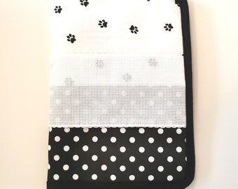 Health book cover to embroider in cross stitch, dog paws and black polka dots.