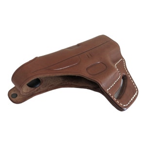 May include: A brown leather holster with white stitching. The holster is designed to fit a handgun and features a molded shape, a belt loop, and a snap closure. The leather has a smooth finish and a slightly glossy appearance.