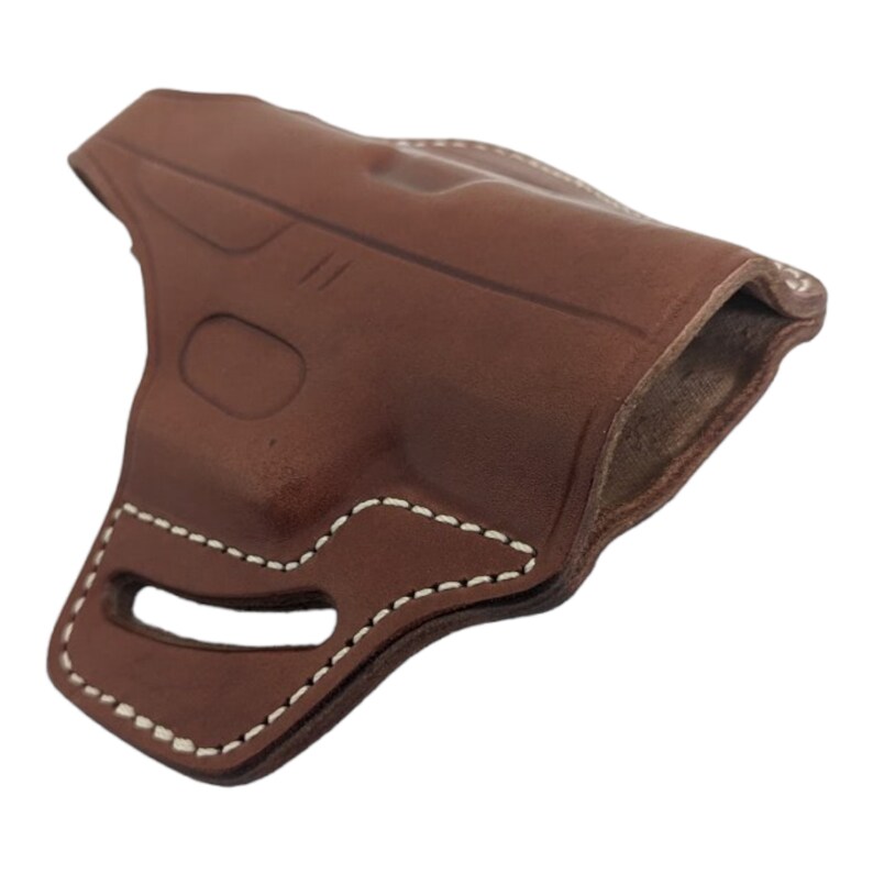 May include: A brown leather holster with white stitching. The holster has a molded shape with an opening at the top and a cutout at the bottom. The leather appears to be smooth and has a slight sheen.