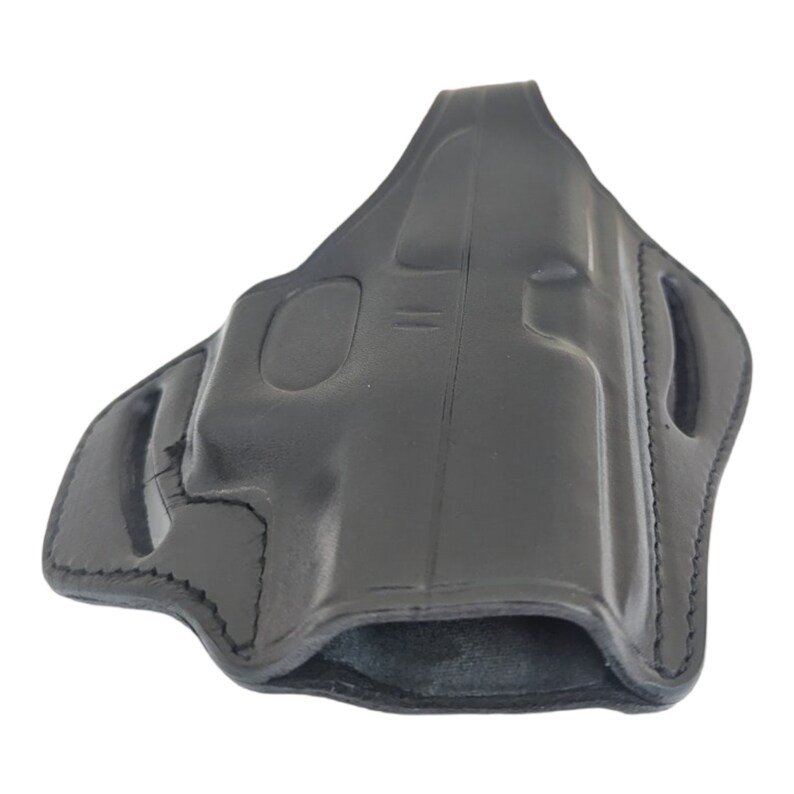 May include: Black leather holster with a molded design. The holster features a contoured shape with reinforced stitching and openings for a belt. The interior is smooth, and the exterior has a polished finish.