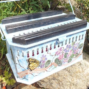 vintage: painting on *grandma&#39;s* old foot warmer, butterfly on violets