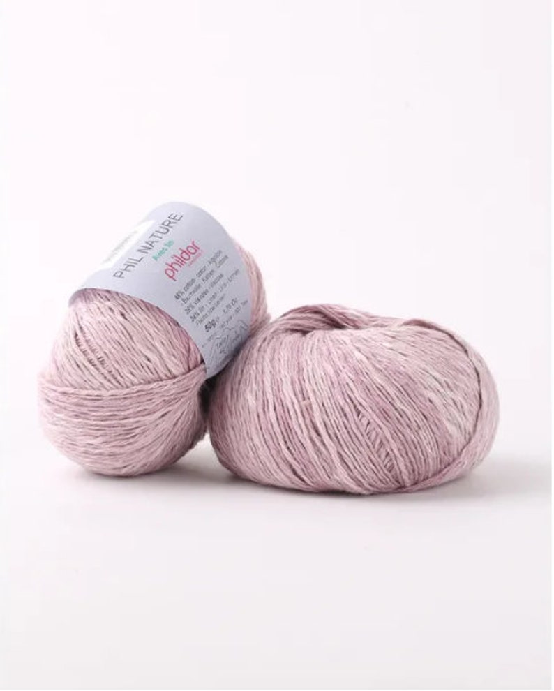 May include: Two skeins of pale pink Phil Nature yarn, a blend of linen and cotton, with a label that reads "Phil Nature" and "Phildar".