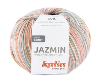 May include: A ball of yarn in a multi-colored striped pattern of pink, beige, and green. The yarn is labeled "Jazmin Non-Stop Creativity" and is a limited edition Katia brand yarn. The label also states that the yarn is 50% acrylic and contains 150 grams of yarn.