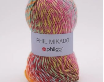 May include: A ball of multi-colored yarn with a label that reads "PHIL MIKADO" and "phildar" in a pink, yellow, orange, and blue color scheme.