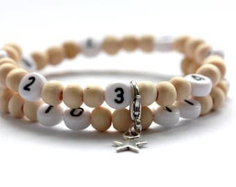 Bracelet d'allaitement sur fil à mémoire de forme de 55mm avec perles en bois neutre