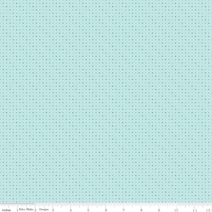 May include: A light blue fabric with a repeating pattern of small teal dots.