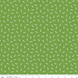 May include: A green fabric with a white repeating pattern of a potted plant with a single flower. The fabric is a repeating pattern of the potted plant.