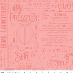 May include: A vintage-style fabric with a salmon-pink background. The design features text and illustrations related to home laundering and shirt pressing. Includes the words "Shirts", "Press On", and "Home Laundering".