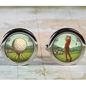 May include: A pair of silver cufflinks with a golf theme. One cufflink features a golf ball on a tee with a golf cart in the background. The other cufflink features a golfer swinging a golf club with a golf cart in the background. Both cufflinks have the text "Country Club" and "Sept 24" on them.