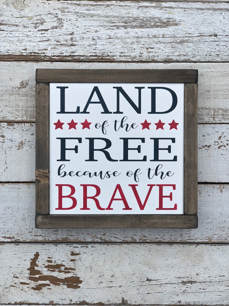 Land of the Free because of the Brave Wood Sign