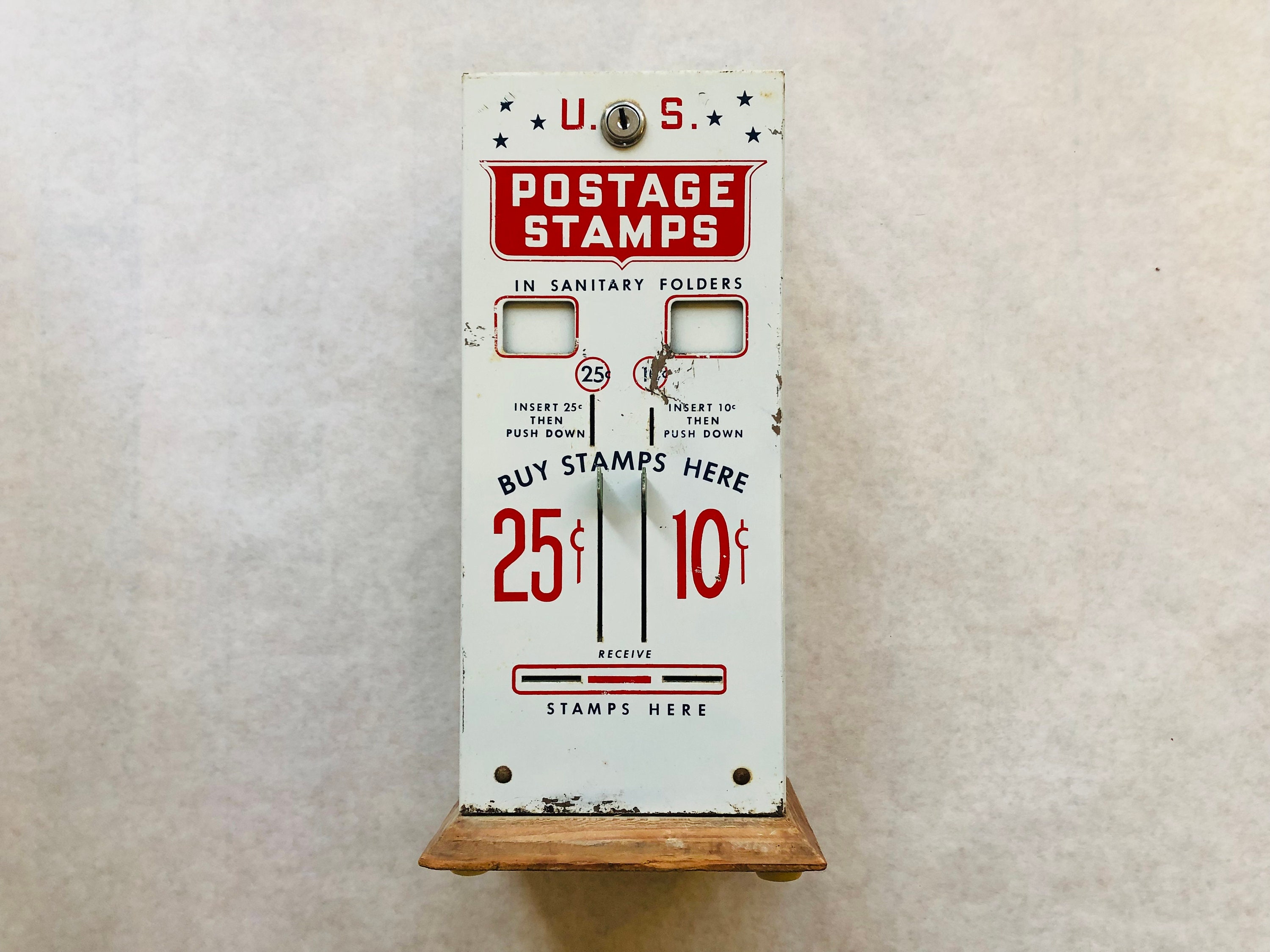 A cute little USPS Mailbox postage stamp dispenser.