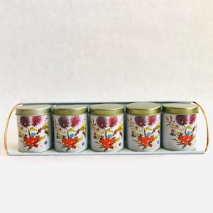 Vintage spice jars with rack, vintage small canisters with rack, vintage thistle flower tins with wall rack, vintage floral tin canister set