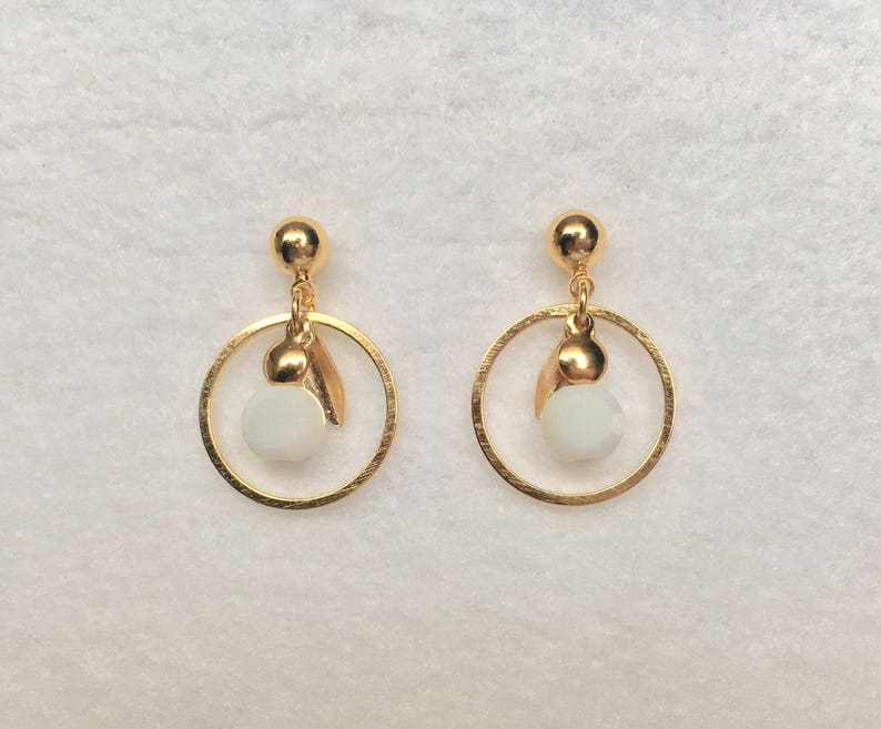 Gold earrings in fine gold small creoles with white boho glass bead with faceted