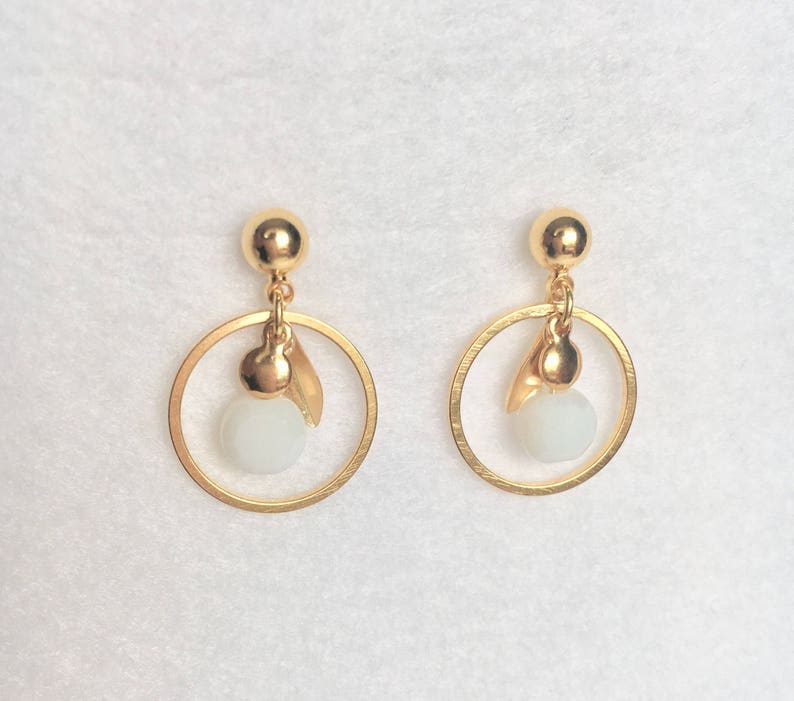 Gold earrings in fine gold small creoles with white boho glass bead with faceted