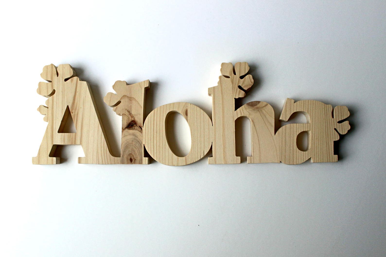 4 images 1 mot sculpture en bois en 4 lettres
