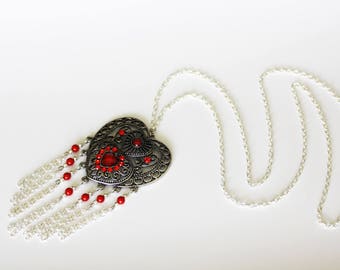 Necklace with heart pendant and coral beads